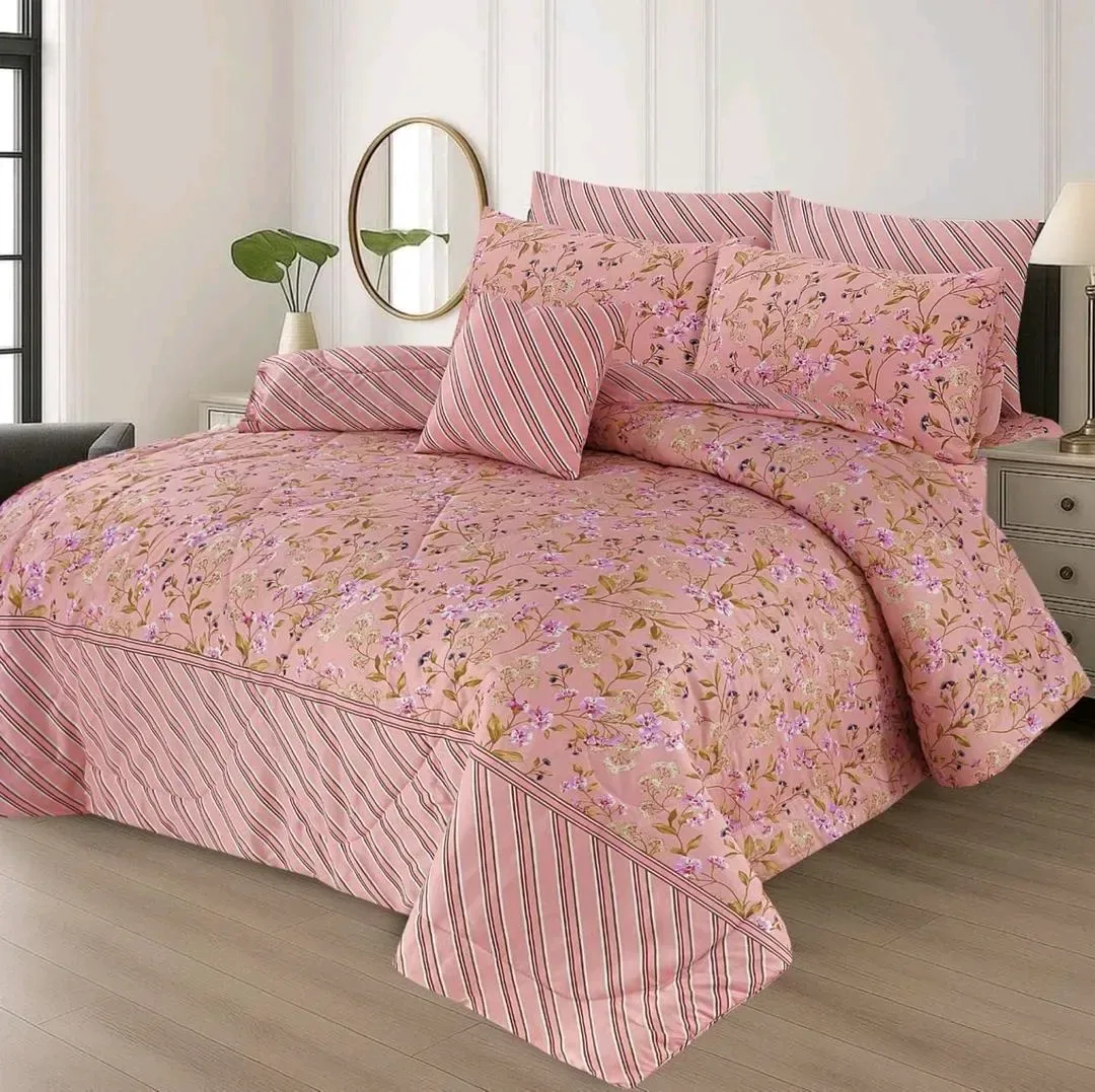 Pink Floral Quilted Bedding Set for Bedroom
*Product Description*: 
*Product Details*:Fabric: Cotton Salonica
Pattern: Printed
Bed Size: Double Bed
Number Of Pieces: 7 Pcs
Package Includes: 1 x Bedsheet, 1 x Filled Comforter, 4 x Pillow Covers, 1 x Cushio